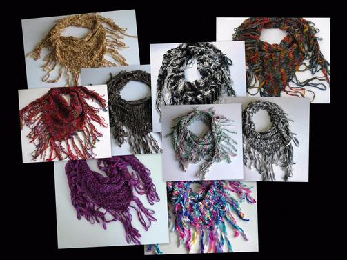 Scarves with fringe that are hand knit.